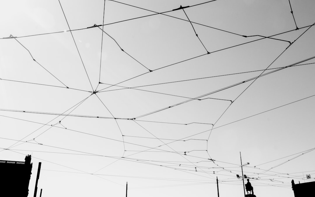 grayscale photography of metal cables