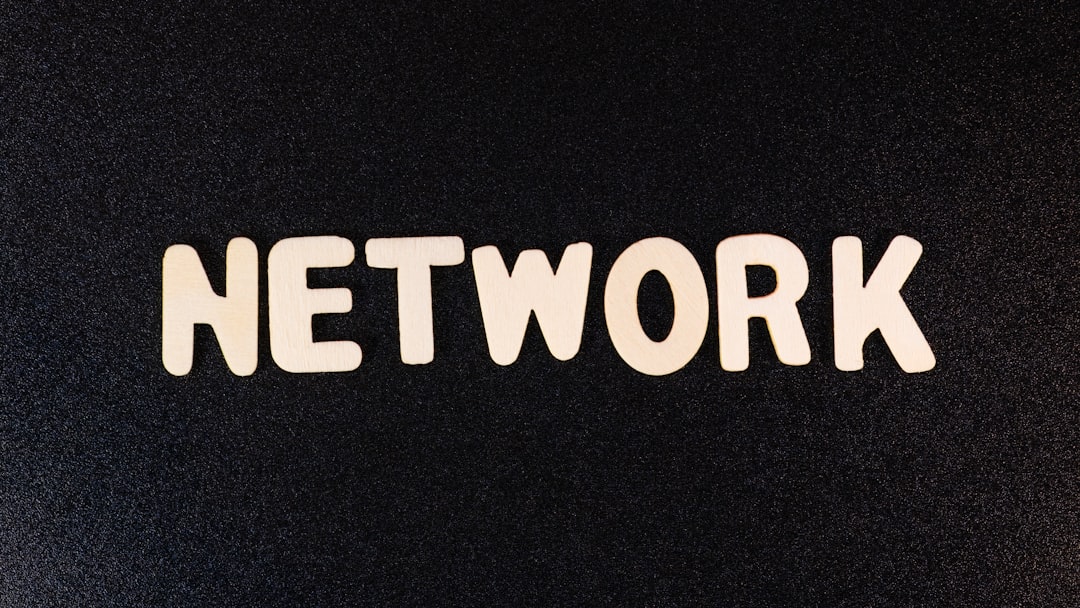 a close up of the word network on a black surface